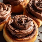 Chocolate cinnamon rolls with chocolate cream cheese frosting First Image